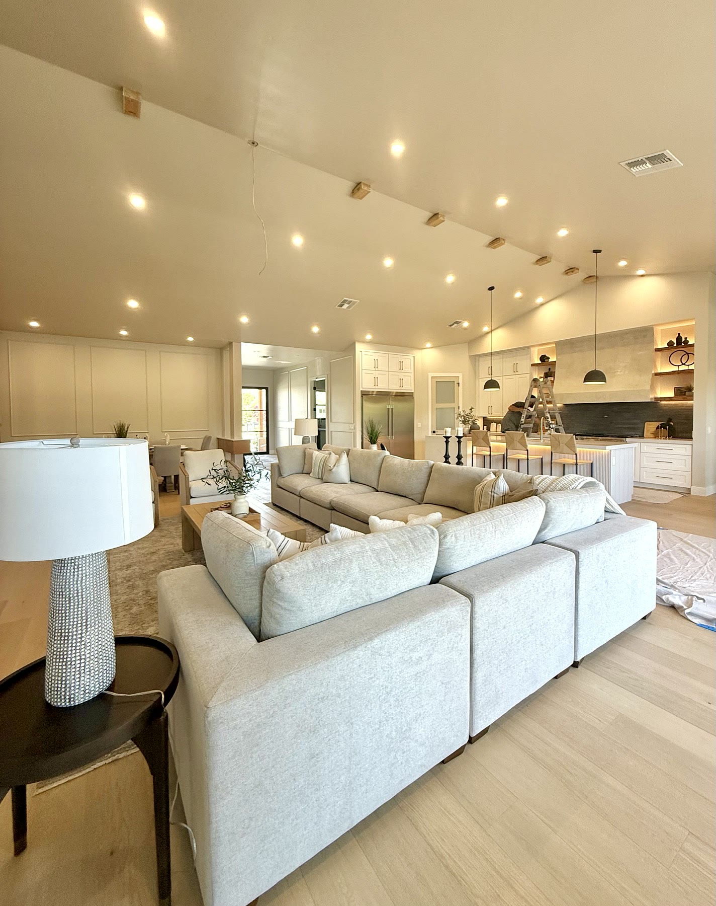 Bright vacant living room staged with neutral furniture